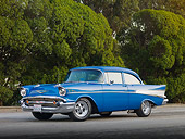 AUT 21 RK2365 01
1957 Chevrolet Bel Air 210 Blue 3/4 Front View On Pavement By Trees