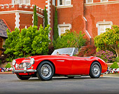AUT 22 BK0014 01
1960 Austin-Healey 3000 BT7 Roadster Red 3/4 Front View On Pavement By Mansion