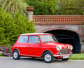 AUT 22 BK0024 01
1961 Mini Mark I Red With White Stripes 3/4 Front View On Pavement By Bridge