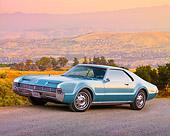 AUT 22 BK0047 01
1966 Oldsmobile Toronado Blue 3/4 Front View On Gravel By Hills