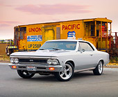 AUT 22 BK0054 01
1966 Chevrolet Chevelle SS Silver 3/4 Front View On Pavement By Train