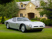AUT 22 BK0087 01
1965 Bizzarrini 5300 GT Strada Silver 3/4 Front View On Grass By House