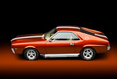 AUT 22 BK0101 01
1969 AMC AMX Candy Tangerine With White Stripes Profile View In Studio