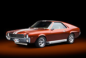 AUT 22 BK0102 01
1969 AMC AMX Candy Tangerine With White Stripes 3/4 Front View In Studio