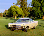 AUT 22 RK0193 06
1968 Cadillac Sedan De Ville Yellow 3/4 Front View On Grass By Trees