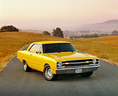 AUT 22 RK0473 08
1969 Dodge 340 Dart Swinger Yellow 3/4 Front View On Pavement Dry Grass At Sunset