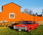 AUT 22 RK0989 04
1965 Plymouth Sport Fury Red 3/4 Front View On Grass By Barn Blue Sky