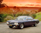 AUT 22 RK1293 02
1965 Chevrolet Corvair Corsa Coupe Turbo Black 3/4 Front View On Pavement By Hills And Trees Filtered