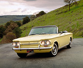 AUT 22 RK1298 03
1963 Chevrolet Corvair Turbo Spyder Yellow 3/4 Front View On Pavement By Grass Hill