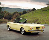 AUT 22 RK1300 06
1963 Chevrolet Corvair Turbo Spyder Yellow 3/4 Rear View On Pavement Trees Grass Hill Red Filter