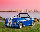 AUT 22 RK1346 02
1966 Austin Mini Cooper Blue White Stripe 3/4 Rear View On Grass By Water