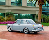 AUT 22 RK1429 05
1964 Volkswagen 1500 Sedan Gray 3/4 Rear View By Building Trees And Flowers