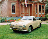 AUT 22 RK1442 01
1968 Volkswagen Karmann Ghia Coupe Beige 3/4 Front View On Grass By House