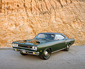 AUT 22 RK1499 05
1969 Dodge Hemi Cornet RT Green 3/4 Front View On Pavement Against Rock Mountain