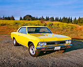 AUT 22 RK1518 05
1966 Chevrolet Chevelle SS Modified Yellow 3/4 Front View On Gravel By Field Of Yellow Flowers