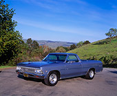 AUT 22 RK1669 01
1966 Chevy El Camino Light Blue 3/4 Side View On Pavement By Grass Hill Blue Sky