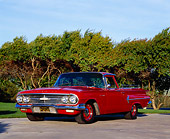 AUT 22 RK1674 03
1960 Chevy El Camino Red Low 3/4 Front View On Pavement Trees Background Blue Sky