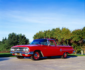 AUT 22 RK1675 02
1960 Chevy El Camino Red Low 3/4 Side View On Pavement Trees Background Blue Sky