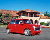 AUT 22 RK2047 02
1969 Austin Mini Cooper Custom Red Low 3/4 Side View On Pavement By Building