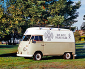 AUT 22 RK2089 02
1967 Volkswagen High Roof Bus Gray And White 3/4 Side View On Grass By Trees
