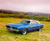 AUT 22 RK2147 04
1969 Dodge Charger R/T SE Blue White Top 3/4 Side View On Grass Gray Clouds
