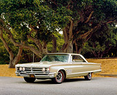 AUT 22 RK2208 01
1966 Chrysler 300 Gold 3/4 Side View On Pavement By Trees