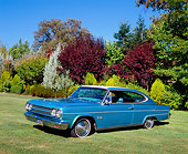 AUT 22 RK2253 02
1965 Rambler Marlin Teal And White 3/4 Side View On Grass By Trees