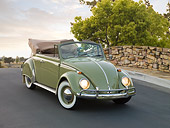 AUT 22 RK2813 01
1965 Volkswagen Beetle Cabriolet Green 3/4 Front View On Pavement By Stone Wall And Trees
