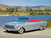 AUT 22 RK2819 01
1962 Chevrolet Nova 400 Convertible Silver 3/4 Front View On Gravel By Lake And Hills