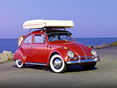 AUT 22 RK2828 01
1964 Volkwagen Beetle Red With Topper Tent 3/4 Front View On Pavement By Ocean