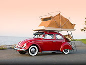 AUT 22 RK2829 01
1964 Volkwagen Beetle Red With Topper Tent 3/4 Front View On Pavement By Ocean