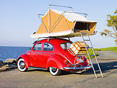 AUT 22 RK2831 01
1964 Volkwagen Beetle Red With Topper Tent 3/4 Rear View On Pavement By Ocean