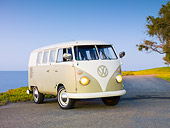 AUT 22 RK2842 01
1964 Volkwagen EZ Camper Mango Green And White 3/4 Front View On Pavement By Ocean