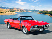 AUT 22 RK2853 01
1968 Oldsmobile 442 W-30 Convertible Red 3/4 Front View On Pavement By Lake