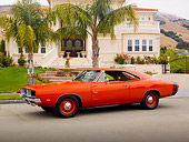 AUT 22 RK2866 01
1969 Dodge Charger R/T Hemi Red 3/4 Front View On Pavement By House