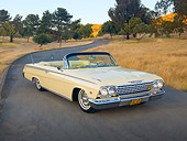 AUT 22 RK2892 01
1962 Chevrolet Impala Convertible Yellow 3/4 Front View On Pavement By Hills