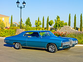 AUT 22 RK2922 01
1968 Pontiac Grand Prix Blue 3/4 Front View On Pavement By Garden