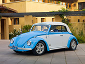 AUT 22 RK2959 01
1969 Volkswagen Beetle Convertible Light Blue And White 3/4 Front View On Pavement By Building