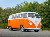 AUT 22 RK3006 01
1965 Volkswagen Kombi Microbus Orange And White 3/4 Front View On Pavement By Trees