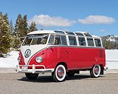 AUT 22 RK3012 01
1960 Volkswagen 23 Window Microbus Orange And White 3/4 Front View On Pavement By Trees