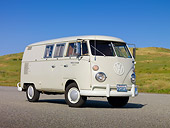 AUT 22 RK3018 01
1966 VW Sundial Camper Pearl White 3/4 Front View On Pavement By Grassy Hill