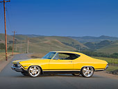 AUT 22 RK3044 01
1968 Chevrolet Chevelle SS 396 Yellow Profile View On Road By Grassy Hills