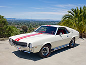 AUT 22 RK3046 01
1969 AMC AMX White With Red Stripe 3/4 Front View On Pavement By Palm Tree