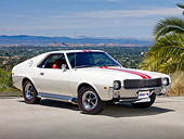 AUT 22 RK3047 01
1969 AMC AMX White With Red Stripe 3/4 Front View On Pavement By Palm Tree