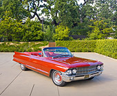 AUT 22 RK3052 01
1962 Cadillac Series 62 Convertible Red 3/4 Front View On Pavement By Hedge And Trees