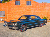 AUT 22 RK3086 01
1967 Plymouth Hemi GTX Dark Green 3/4 Front View On Gravel By Brick Building