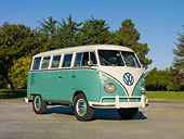 AUT 22 RK3092 01
1963 VW Deluxe Bus Turquoise And White 3/4 Front View On Pavement By Grass And Trees