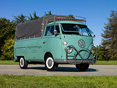 AUT 22 RK3101 01
1964 VW Pickup Single Cab Turquoise 3/4 Front View On Pavement By Grass And Trees