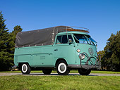 AUT 22 RK3102 01
1964 VW Pickup Single Cab Turquoise 3/4 Side View On Pavement By Grass And Trees