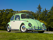 AUT 22 RK3106 01
1967 Volkswagen Bug Green And White 3/4 Front View On Pavement By Grass And Trees